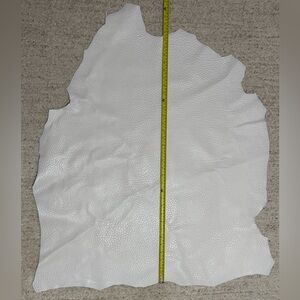Tan Firm Embossed Leather Hide White color